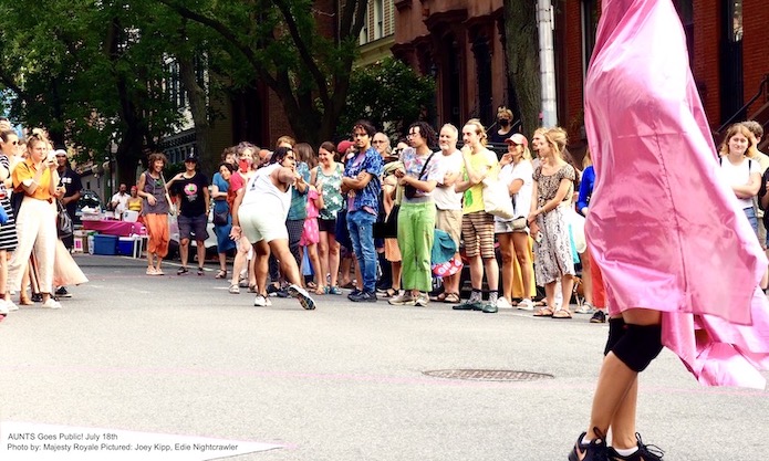 Crowd of people on an NYC street watching Joey Kipp & Edie Nightcrawler performing
