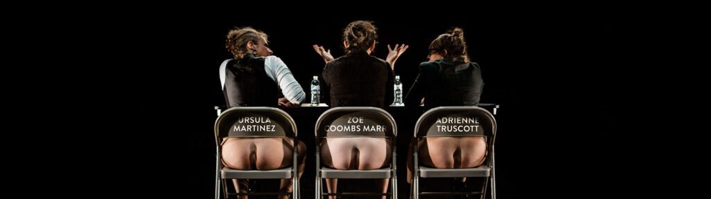 Three people sit on chairs with their backs to the camera; their bare buttocks are visible through cutouts in the chairs, which each display a name: Ursula Martinez, Zoe Coombs Marr, and Adrienne Truscott.