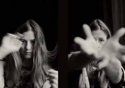 Two black-and-white photos side by side show a woman with long hair moving her hands, creating a blurred effect. She looks toward the camera in both images, with expressive and dynamic gestures.