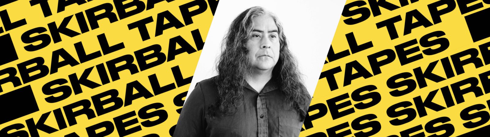 A person with long hair and a serious expression is pictured in black and white, centered on a background of repeated yellow and black text that reads “Skirball Tapes.”.