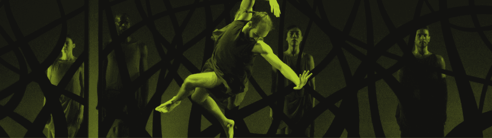 A dancer leaps mid-air in front of four standing figures, all set against a dark background with abstract, crisscrossing lines. The image has a strong green-yellow tint.