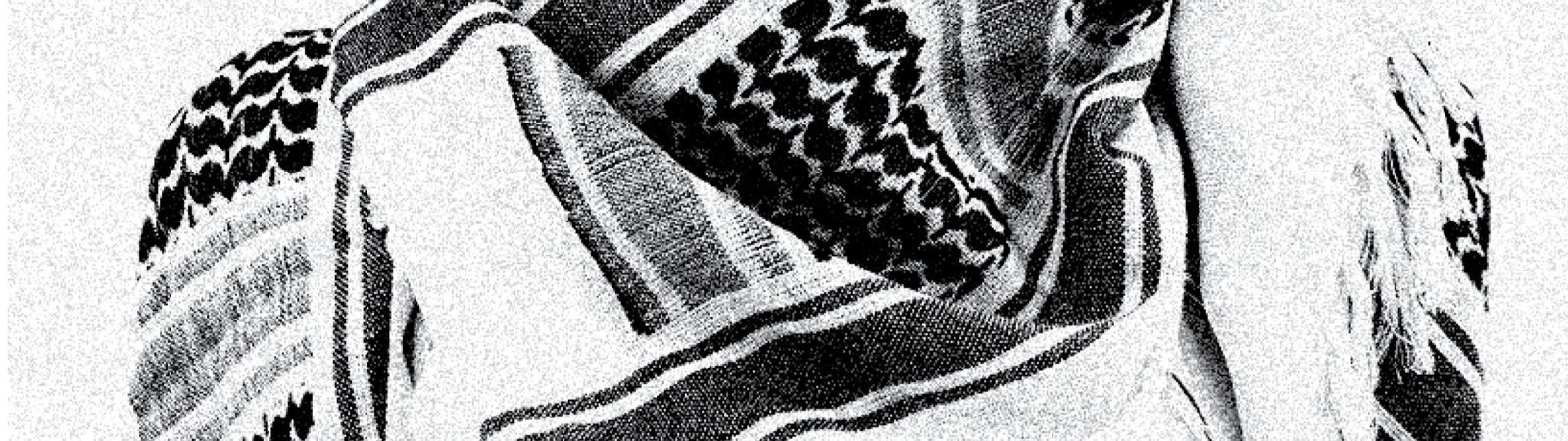 A person wears a patterned keffiyeh scarf around their head and shoulders. The image is black and white with a grainy texture.