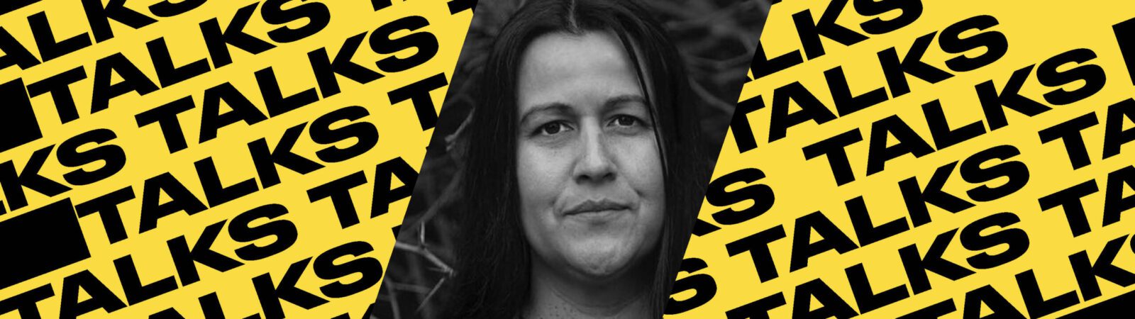 A black-and-white photo of a person is centered on a yellow background with the word “TALKS” repeatedly printed in bold black letters diagonally across the image.