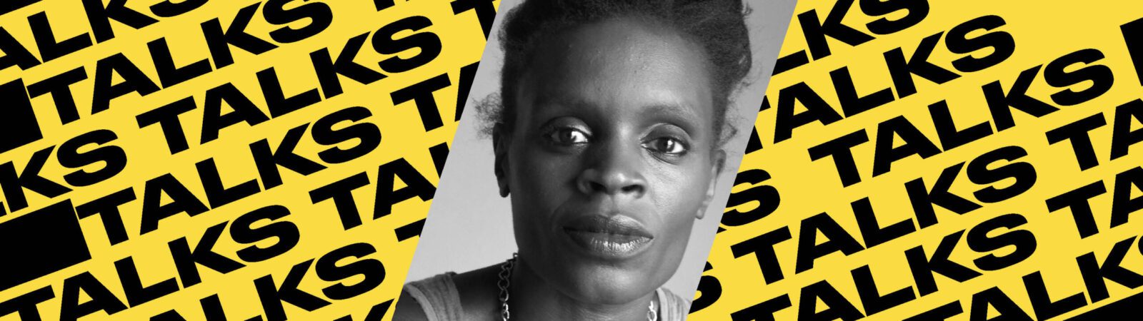 A black-and-white portrait of a woman is centered over a yellow background patterned with the word “TALKS” in bold black letters repeated diagonally.