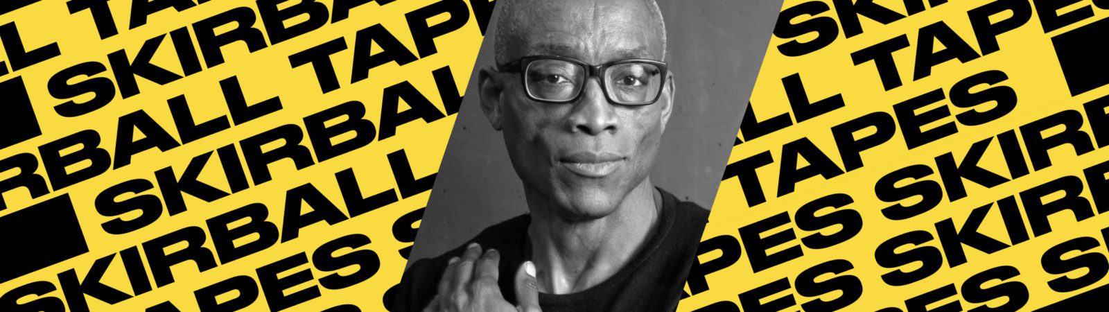 Black-and-white portrait of a person with glasses over a yellow background patterned with the repeated words “SKIRBALL TAPES” in bold black letters.